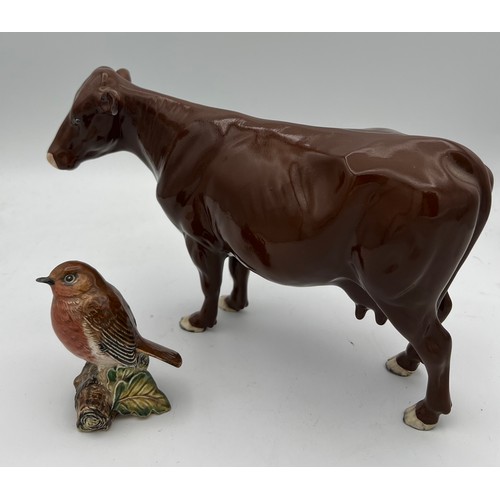 231 - Beswick brown cow 24cm long, Beswick Robin and a Royal Worcester First Dance modelled by F.G.Doughty... 