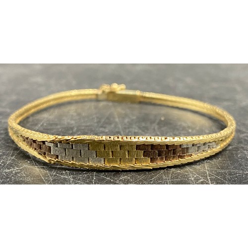 445 - Nine carat gold tri-colour bracelet. Weight 7.8gm.