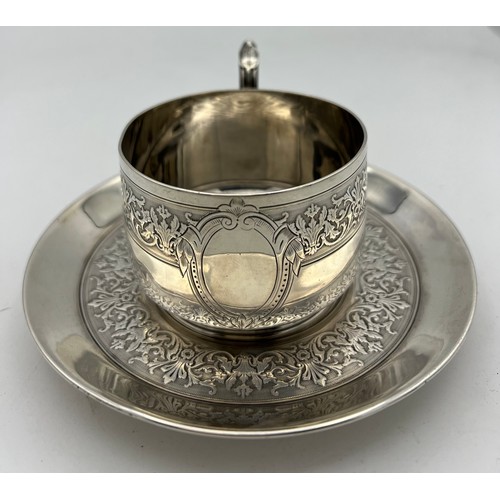 691 - A French silver cup and saucer marked with Minerva and AM Tallois & Mayenge 19 Bd, de Strasbourg Par... 