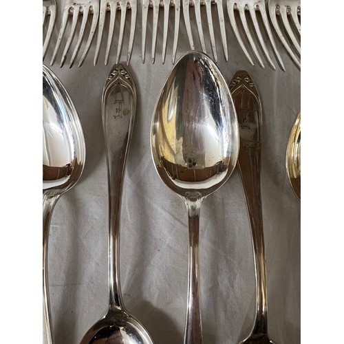 692 - An extensive suite of German silver cutlery. Marked with German marks and Posen .800. Initialled E. ... 