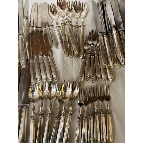 692 - An extensive suite of German silver cutlery. Marked with German marks and Posen .800. Initialled E. ... 