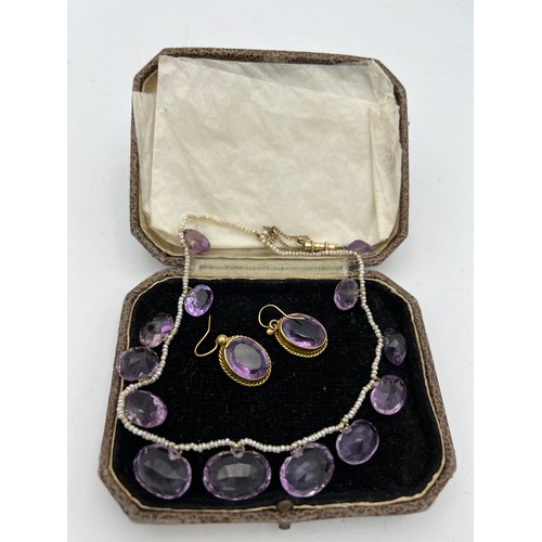 449 - Amethyst and seed pearl necklace together with amethyst 9ct earrings in unmarked yellow metal mounts... 