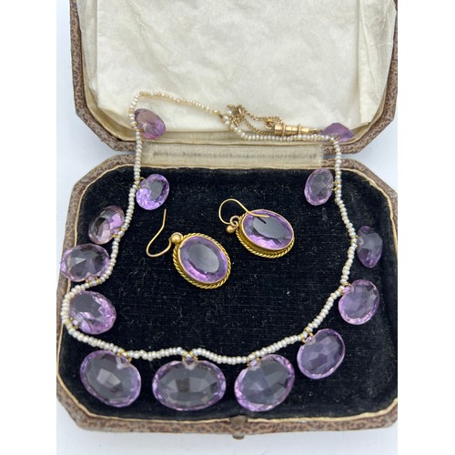 449 - Amethyst and seed pearl necklace together with amethyst 9ct earrings in unmarked yellow metal mounts... 