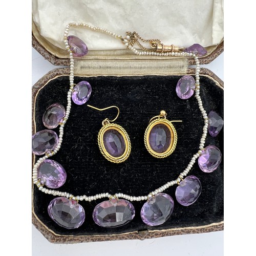 449 - Amethyst and seed pearl necklace together with amethyst 9ct earrings in unmarked yellow metal mounts... 