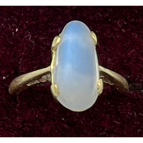 453 - A yellow metal ring set with moonstone. Size L. Marked 18K. Weight 4.7gm.