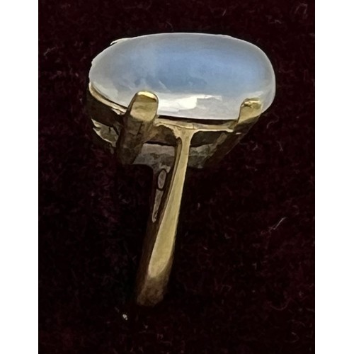 453 - A yellow metal ring set with moonstone. Size L. Marked 18K. Weight 4.7gm.