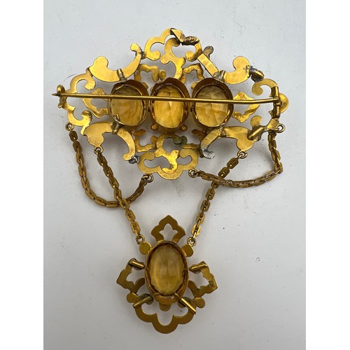 456 - A 19thC brooch set with citrines in yellow metal together with a pair of citrine 
 9ct gold earrings... 