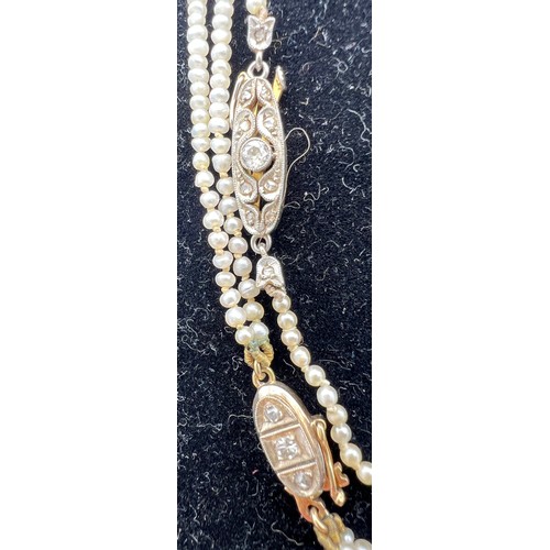 457 - Two seed pearl necklaces, one double row, one single, both with yellow metal and diamond set clasps,... 