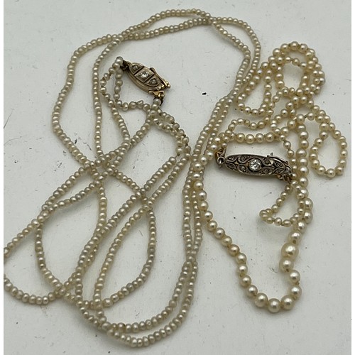 457 - Two seed pearl necklaces, one double row, one single, both with yellow metal and diamond set clasps,... 