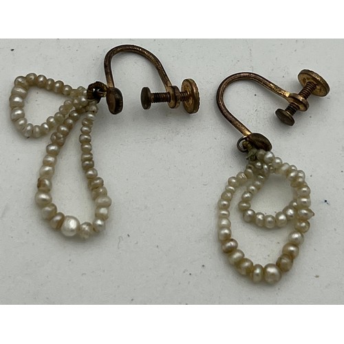 457 - Two seed pearl necklaces, one double row, one single, both with yellow metal and diamond set clasps,... 