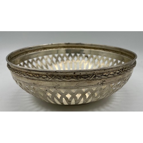 698 - A German silver bowl with pierced decoration. Weight 245gm, size 20cm d.