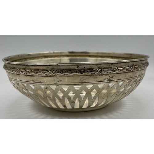 698 - A German silver bowl with pierced decoration. Weight 245gm, size 20cm d.