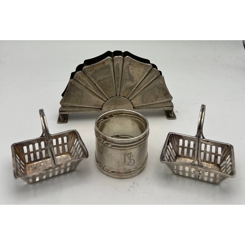 699 - Silver to include two baskets marked .925, German silver napkin ring .800 and a German silver menu h... 