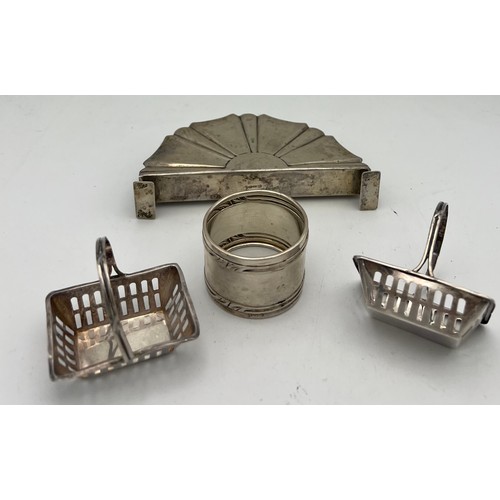 699 - Silver to include two baskets marked .925, German silver napkin ring .800 and a German silver menu h... 