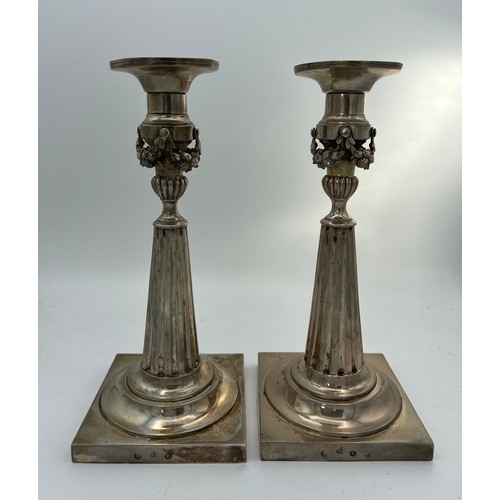 702 - A pair of German silver candlesticks c.1860 22.5cm h. Total weight approximately 583gm.