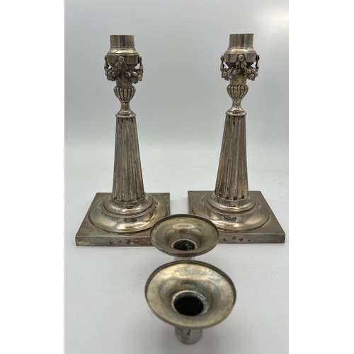 702 - A pair of German silver candlesticks c.1860 22.5cm h. Total weight approximately 583gm.