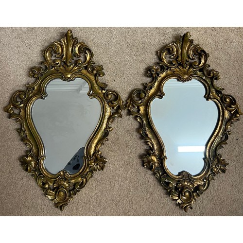 947 - Two ornate gilt framed wall mirrors. 52 x 37 cm.