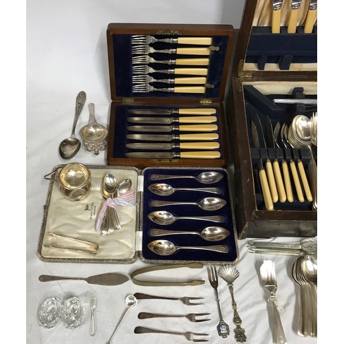 690 - A large quantity of silver plated cutlery to include lobster and walnut picks, some in original boxe... 