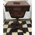 A mahogany ladies sewing table, with compartmental  drawer over a tapering wool drawer, on turned co... 