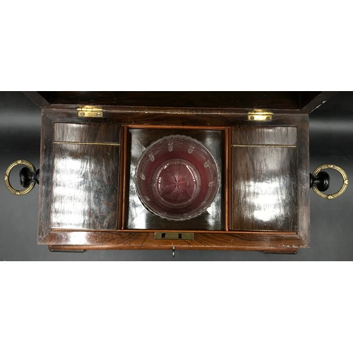 792 - A rosewood tea caddy with a hinged lid, two ring handles, key and working lock, mother of pearl escu... 