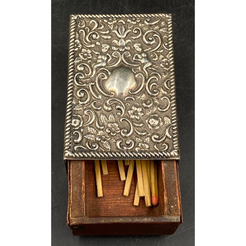 707 - An embossed hallmarked silver match box holder. Birmingham 1906 maker Cornelius Desormeaux Saunders ... 