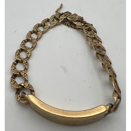 437 - A 9 carat gold identity bracelet. Weight 39.1gm.