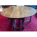 An oak gateleg dining table. 115 x 150cm open.