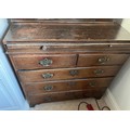 A 19thC oak chest of 2 short over 3 long drawers on bracket feet brass handles with brushing slide t... 
