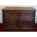 An 18th/19thC oak chest, two drawers over 2 cupboards, replacement handles and hinges. 80 h x 122 w ... 