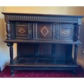 Oak two height chest with inlaid panels and carving to frieze, two cupboards to top. 133 h x 150 w x... 