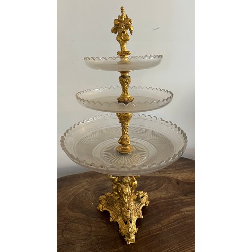 1020 - A 19thC ormolu and glass three tier tazza. 55cm h.