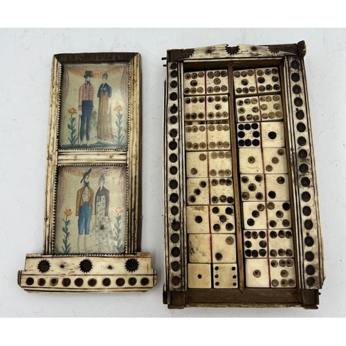 1024 - A Napoleonic prisoner of war box containing dominoes and two dice. Painted scenes to top. 15 x 8cm. ... 