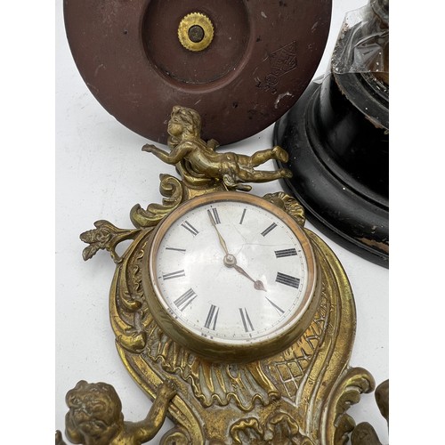 1025 - Nineteenth century bronze figure, brass wall mounted clock and a metal figure of heron and snake 22c... 