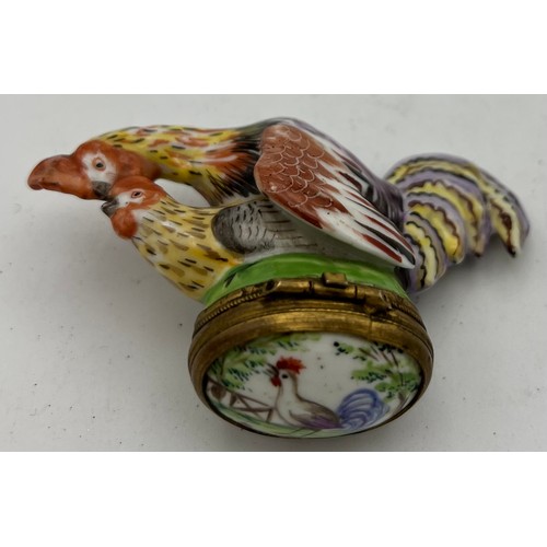 1040 - An 18/19thC continental porcelain cock and hen snuff box.