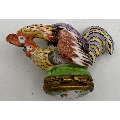 1040 - An 18/19thC continental porcelain cock and hen snuff box.