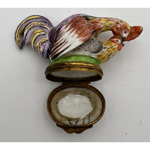 1040 - An 18/19thC continental porcelain cock and hen snuff box.