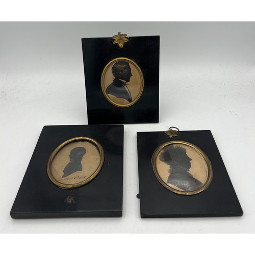 1046 - Three 19thC oval portrait silhouettes in similar ebonised fames. 14 x 16cms. One inscribed John Hall... 