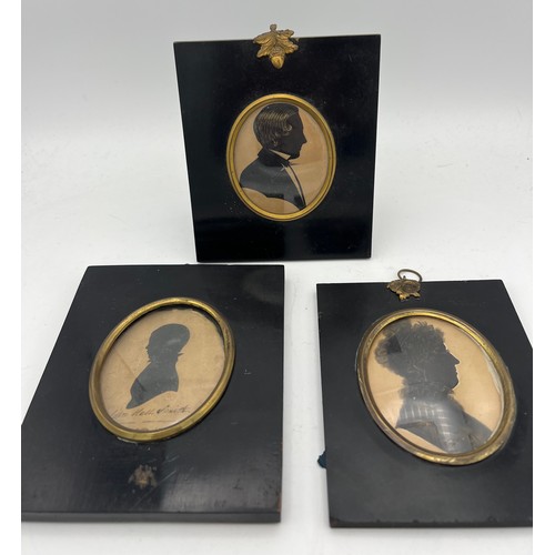 1046 - Three 19thC oval portrait silhouettes in similar ebonised fames. 14 x 16cms. One inscribed John Hall... 