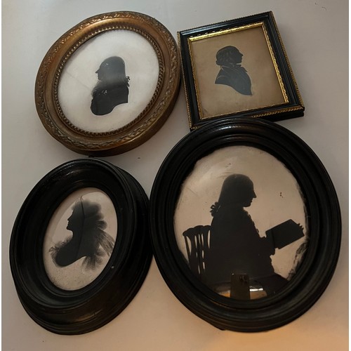 1047 - Four framed 19thC oval portrait silhouettes. Largest 17.5 x 15cm.