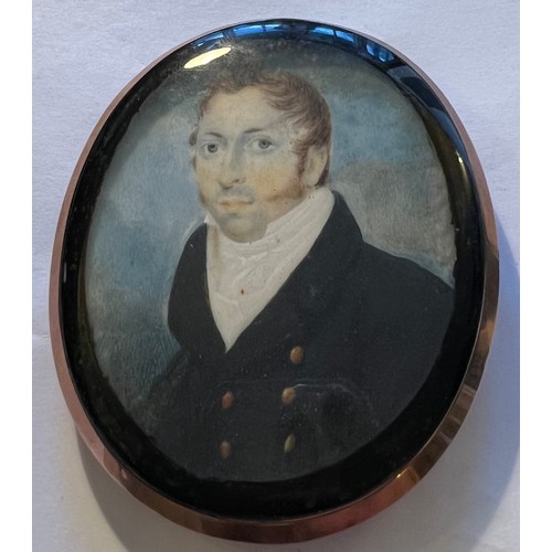 1056 - A portrait miniature on ivory of a gentleman with hair work and monogram to reverse. Size 8.5 x 7cm.... 