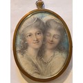 A portrait miniature on ivory of two young ladies. Size 8 x 6.5cm. Hair to reverse. Ivory submission... 