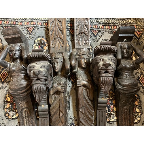 1062 - Three pairs of carved oak caryatids. Largest 78cm l.