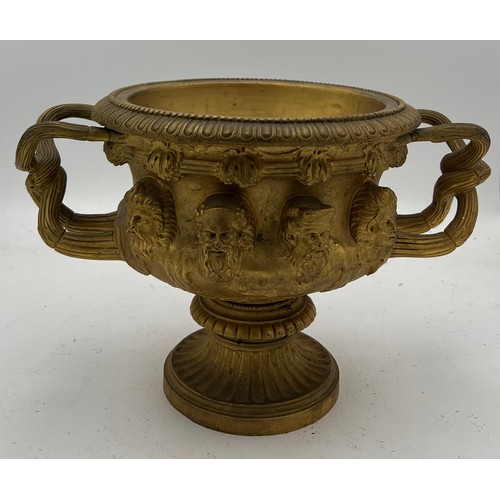 1066 - A 19thC heavy ormolu Warwick vase. 17cm h.