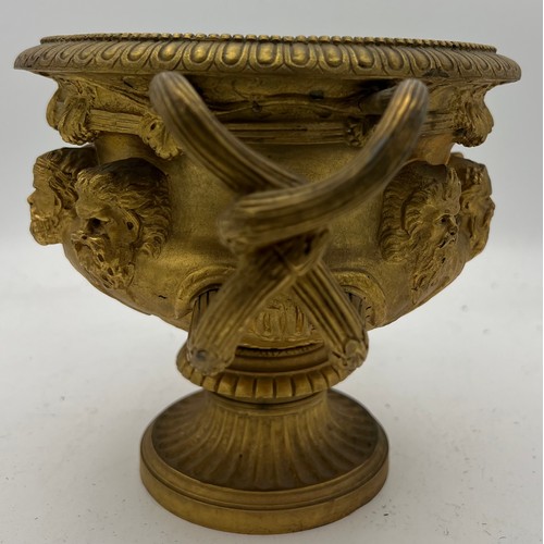 1066 - A 19thC heavy ormolu Warwick vase. 17cm h.