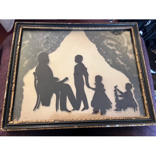 1067 - Auguste Edouart 1780-1861. A 19thC framed silhouette of a family group with black lace back drop sig... 