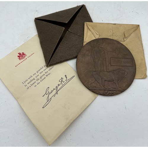 1071 - A WWI Death Penny awarded to Herbert Booty in original packaging.