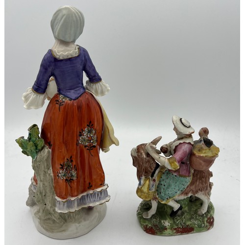 190 - Two 19thC Sitzendorf figures to include mother and three children riding a goat to market.