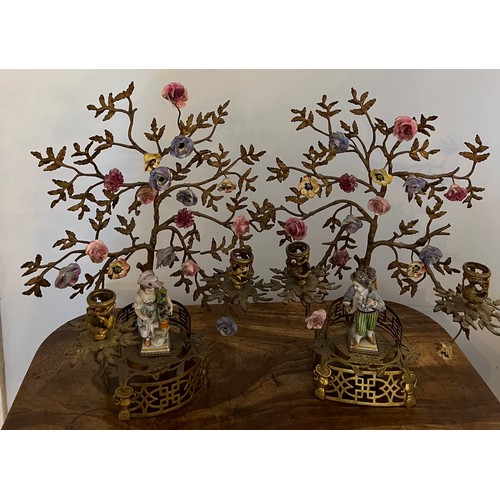 194 - A pair of ormolu candelabra mounted with Meissen figures and flowers. 40cm h.