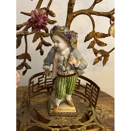 194 - A pair of ormolu candelabra mounted with Meissen figures and flowers. 40cm h.