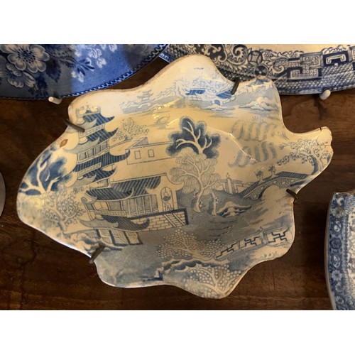 196 - Seven pieces of 19thC blue and white pottery to include two Adams Doctor Syntax plates, pap bowl mar... 